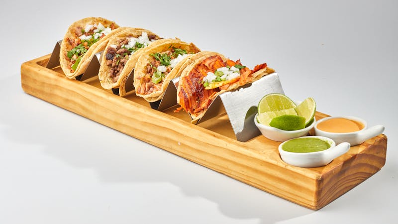 Al Pastor tacos with marinated pork and pineapple